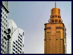 Golden Business Center from 2004 is 228m to the spire and has a golden looking exterior. It is one of many skyscrapers along Shennan Boulevard.